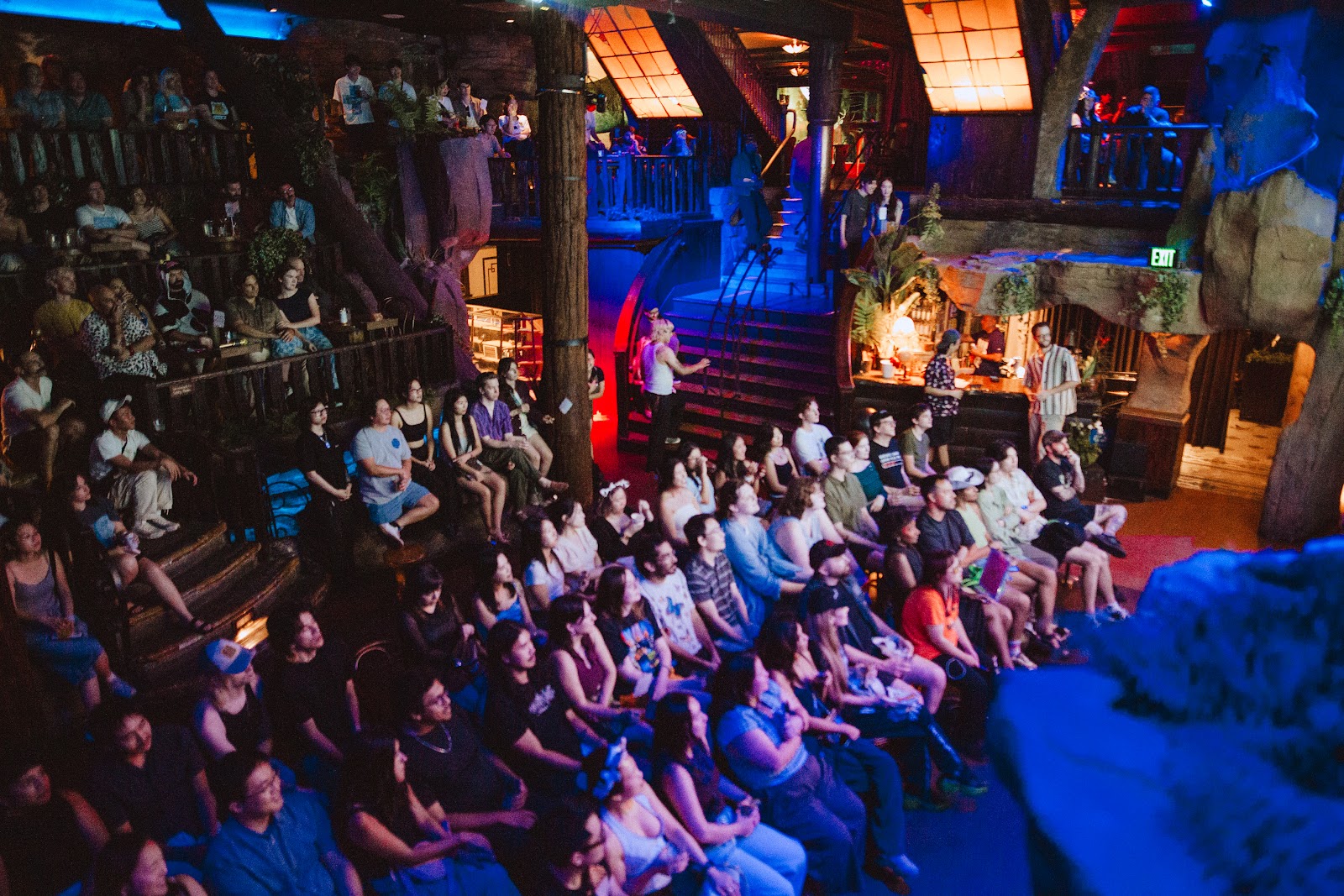 A packed house at Clifton's, balconies full, looking down at the stage